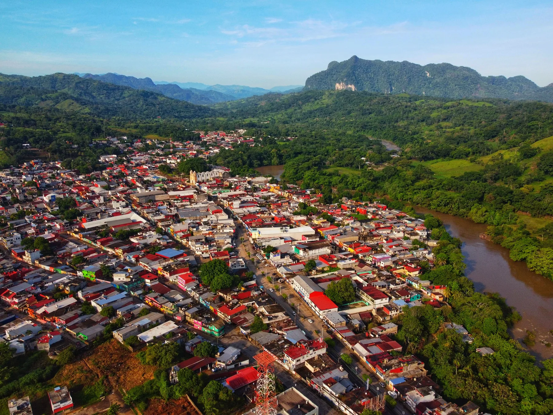 Aerial view of Teapa, Tabasco, Mexico, along the river and surrounded by hills
